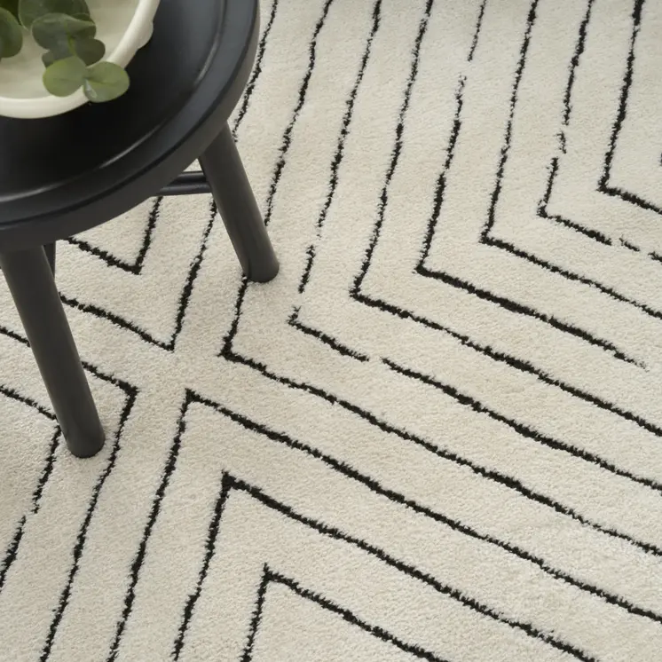 5' X 7' Ivory and Black Abstract Area Rug