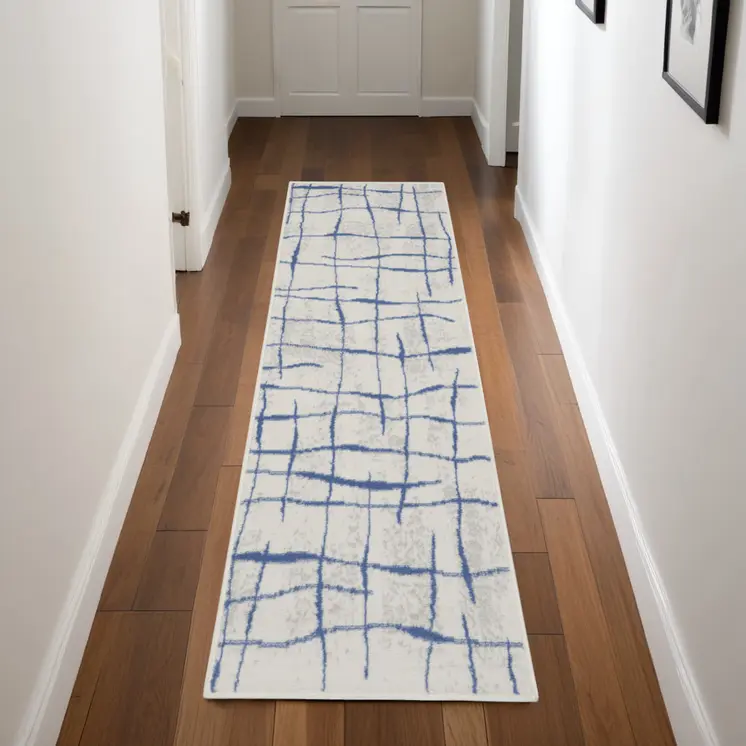 8' Ivory and Blue Abstract Distressed Non Skid Runner Rug