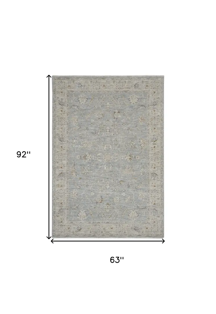 5' X 8' Beige and Blue Floral Power Loom Area Rug