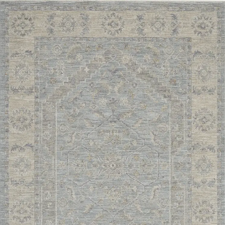 5' X 8' Beige and Blue Floral Power Loom Area Rug