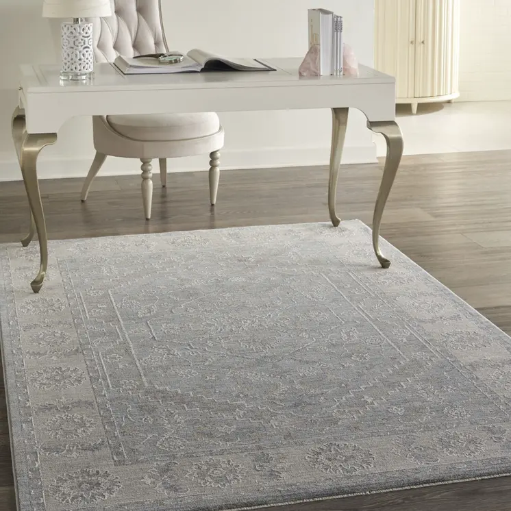 5' X 8' Beige and Blue Floral Power Loom Area Rug