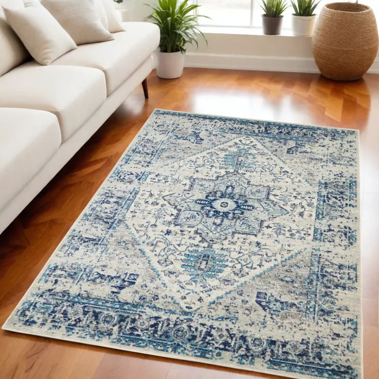 5' X 7' Ivory And Light Blue Floral Medallion Distressed Area Rug