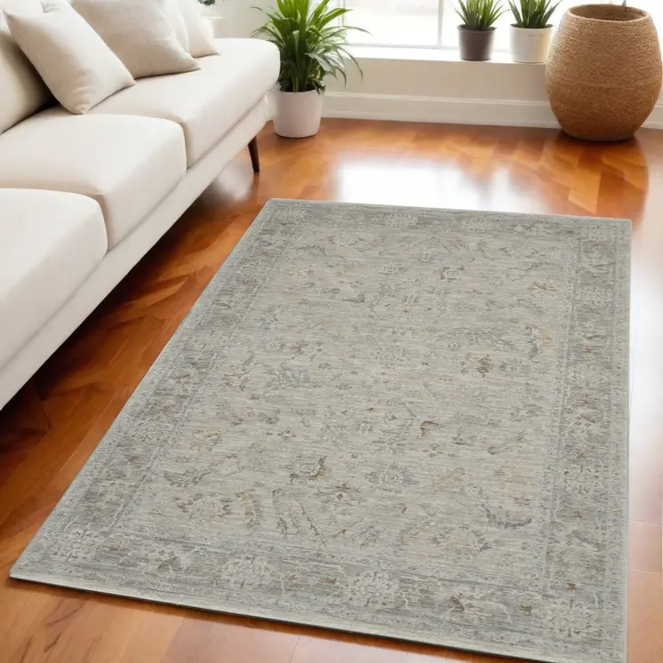 5' X 8' Beige and Gray Floral Power Loom Area Rug