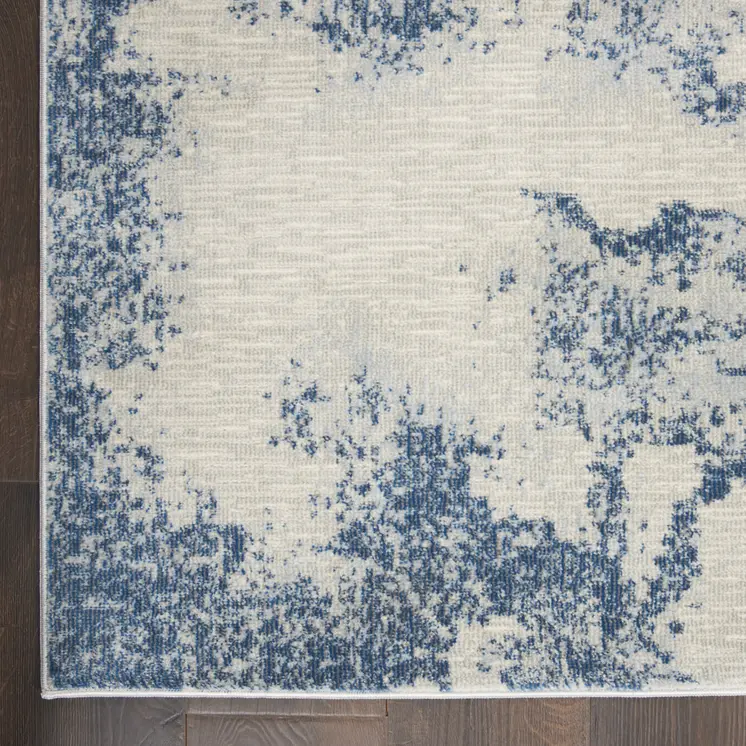 4' X 6' Light Blue and Ivory Abstract Non Skid Area Rug