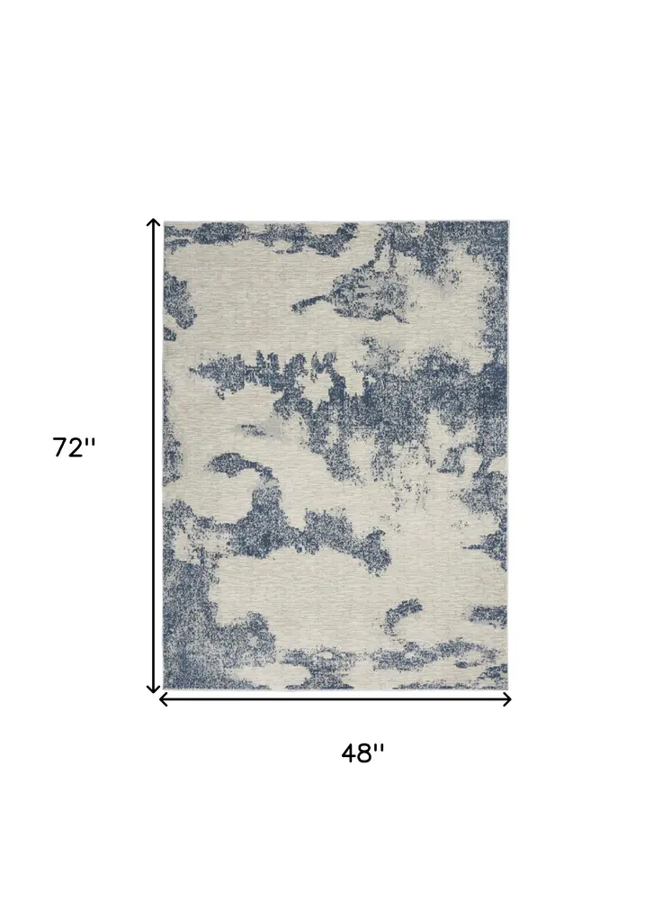4' X 6' Light Blue and Ivory Abstract Non Skid Area Rug