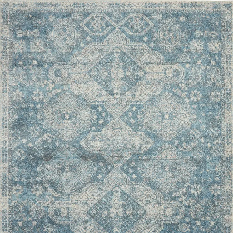7' X 10' Ivory and Light Blue Geometric Distressed Area Rug