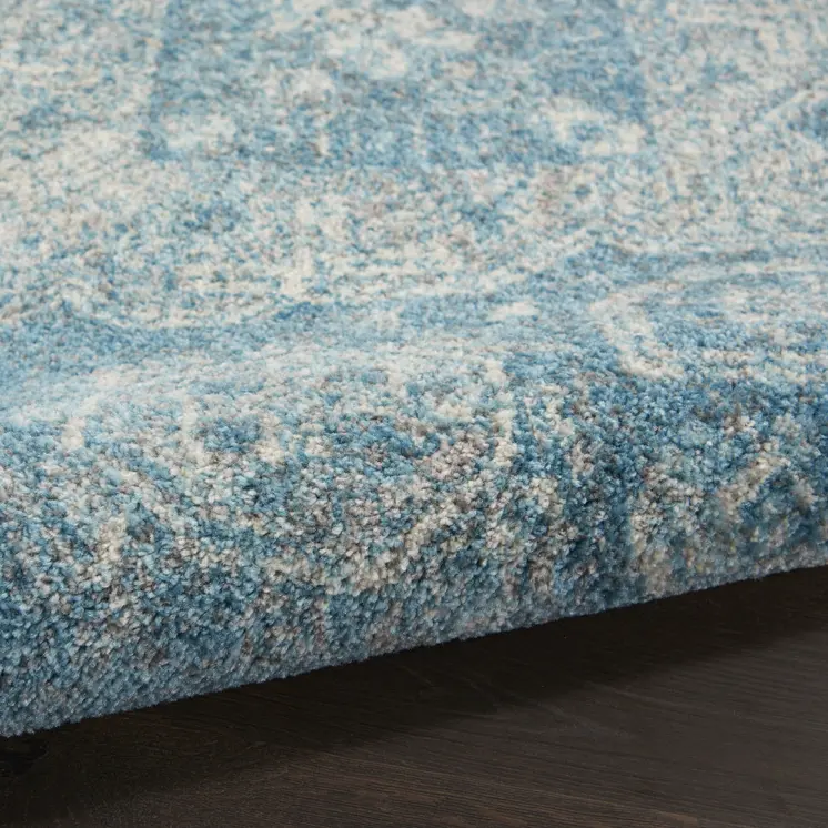 7' X 10' Ivory and Light Blue Geometric Distressed Area Rug