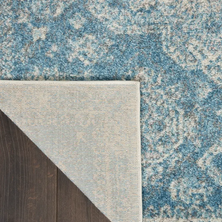 7' X 10' Ivory and Light Blue Geometric Distressed Area Rug
