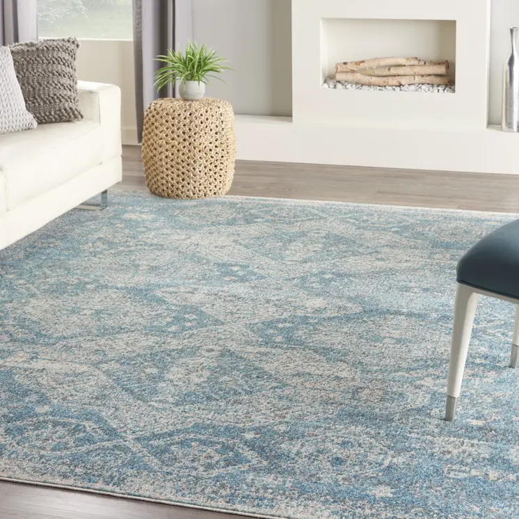 7' X 10' Ivory and Light Blue Geometric Distressed Area Rug