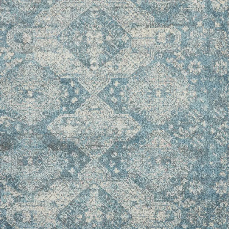 7' X 10' Ivory and Light Blue Geometric Distressed Area Rug