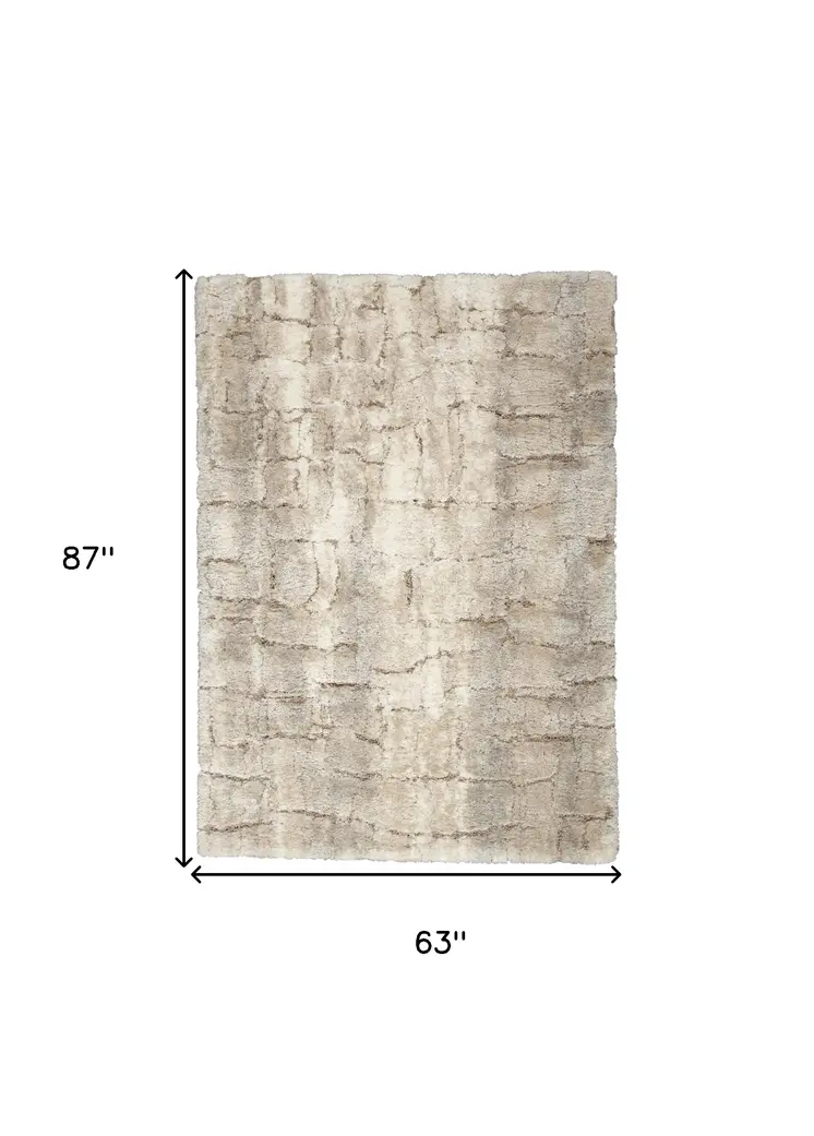 5' X 7' Beige and Ivory Abstract Shag Area Rug