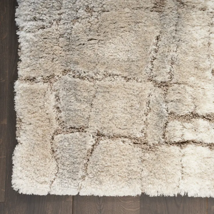 5' X 7' Beige and Ivory Abstract Shag Area Rug