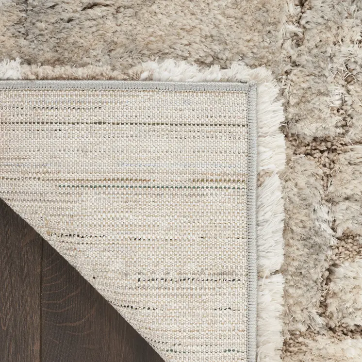 5' X 7' Beige and Ivory Abstract Shag Area Rug