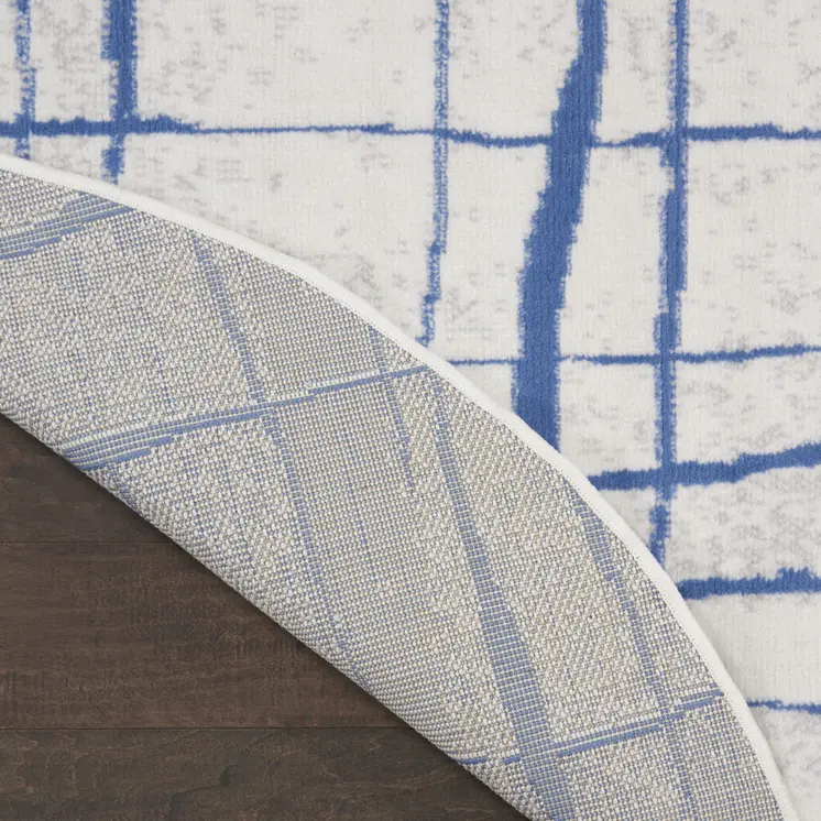 8' Ivory and Blue Abstract Distressed Round Rug