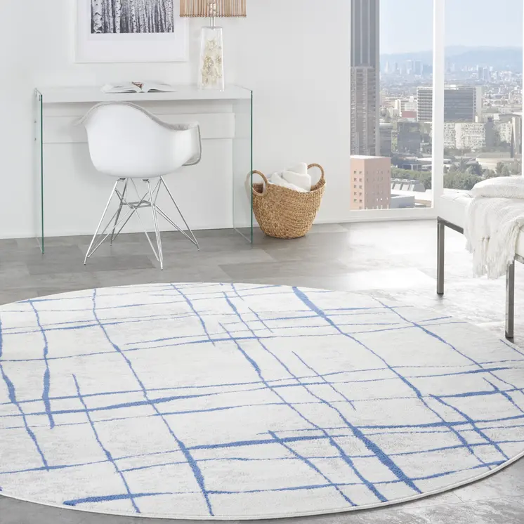 8' Ivory and Blue Abstract Distressed Round Rug
