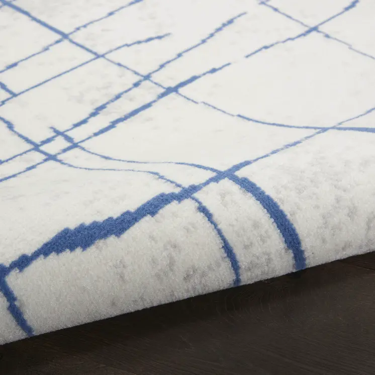 5' Ivory and Blue Abstract Geometric Distressed Round Rug