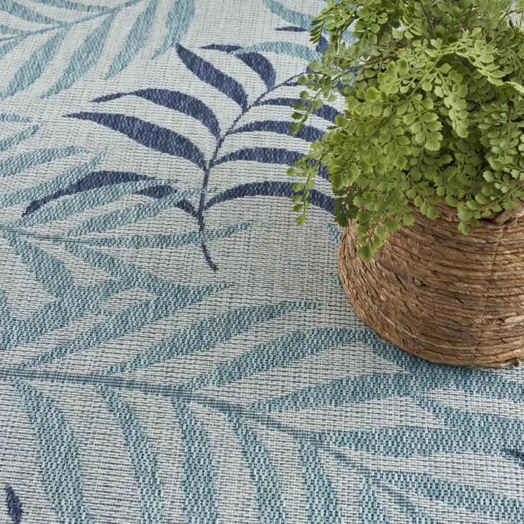 5' X 7' Navy Blue Ivory And Blue Palm Leaf Indoor Outdoor Area Rug