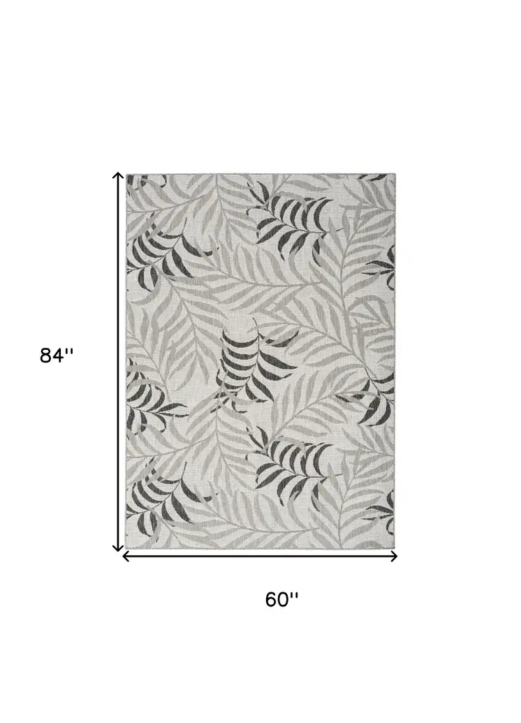5' X 7' Gray Black And Ivory Palm Leaf Indoor Outdoor Area Rug