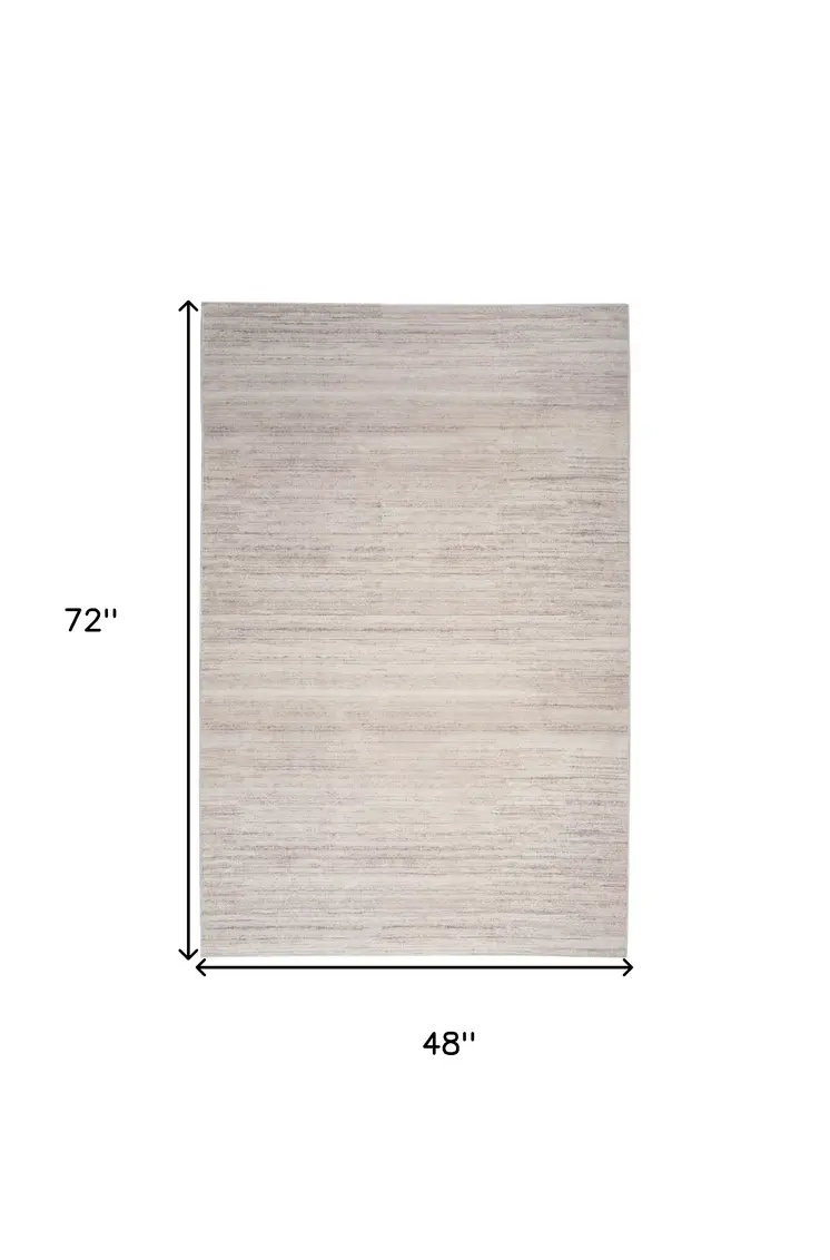 4' X 6' Ivory and Light Brown Abstract Washable Area Rug