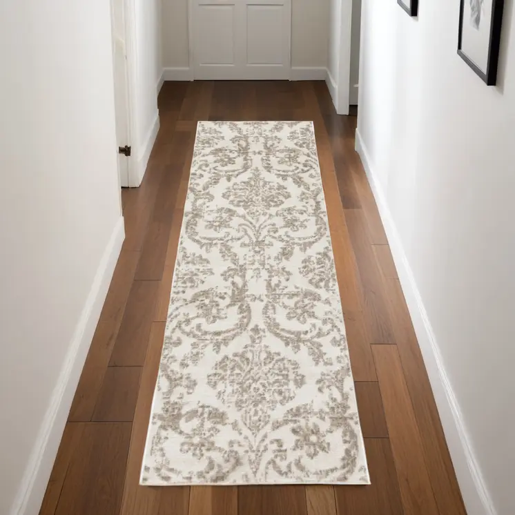 7' Beige and Ivory Damask Distressed Runner Rug