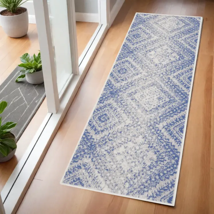 6' Blue and Ivory Geometric Distressed Runner Rug