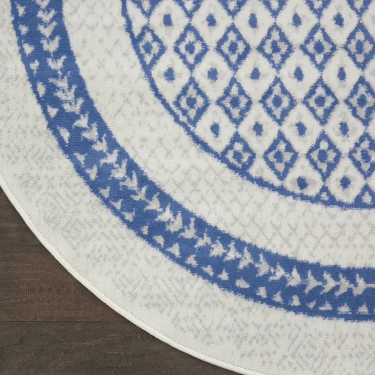 8' Ivory and Blue Geometric Distressed Round Rug