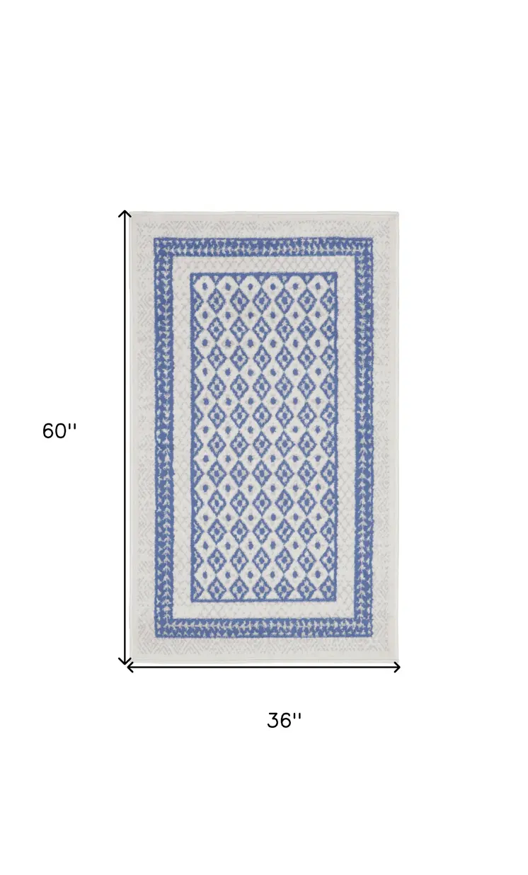 3' X 5' Ivory and Blue Geometric Distressed Area Rug