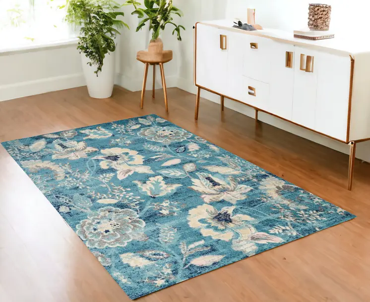 4' X 6' Turquoise Cream and Navy Blue Floral Distressed Area Rug