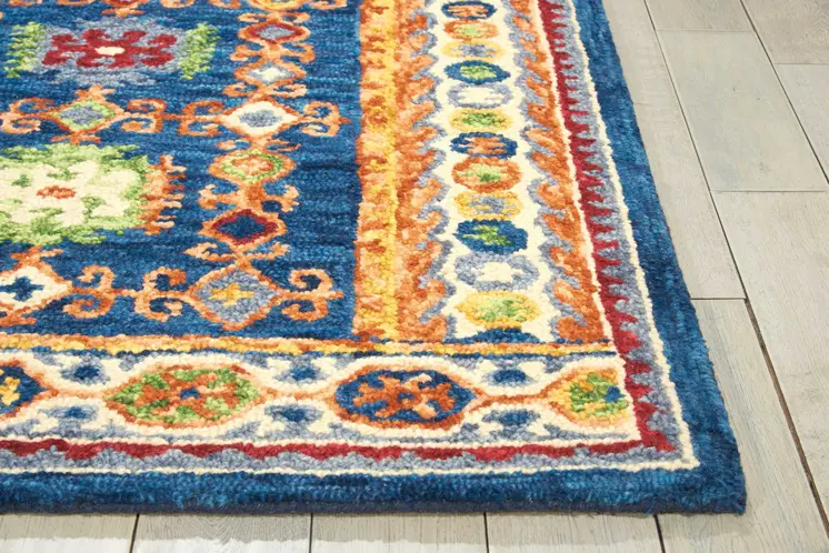 5' X 8' Navy Blue Orange And Green Wool Floral Hand Tufted Distressed Area Rug