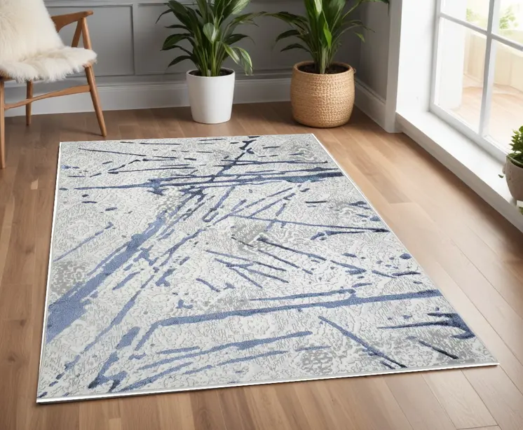 4' X 6' Ivory and Blue Abstract Area Rug