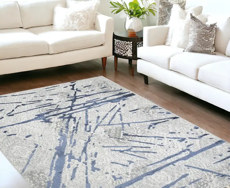 5' X 8' Ivory and Blue Abstract Area Rug