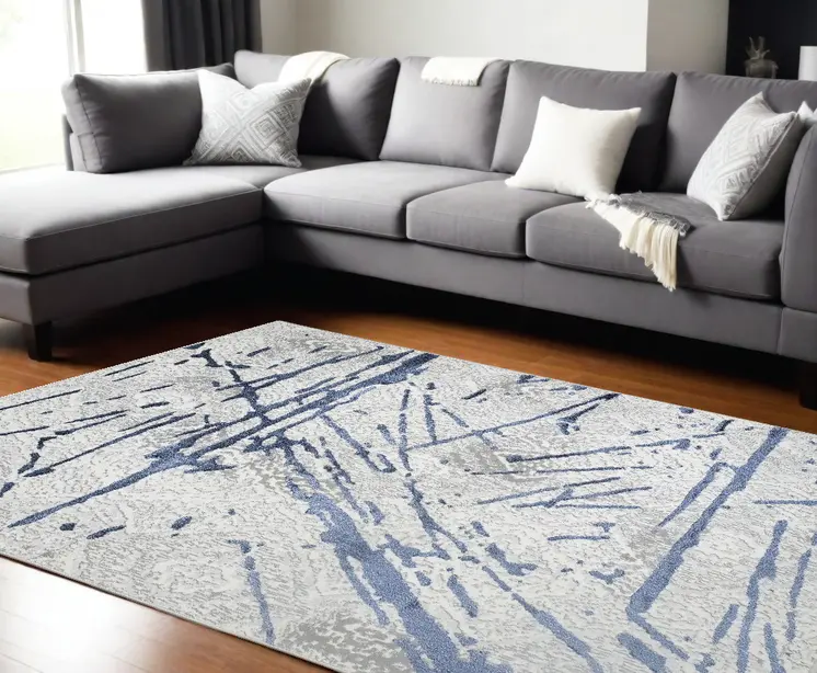 9' X 12' Ivory and Blue Abstract Area Rug