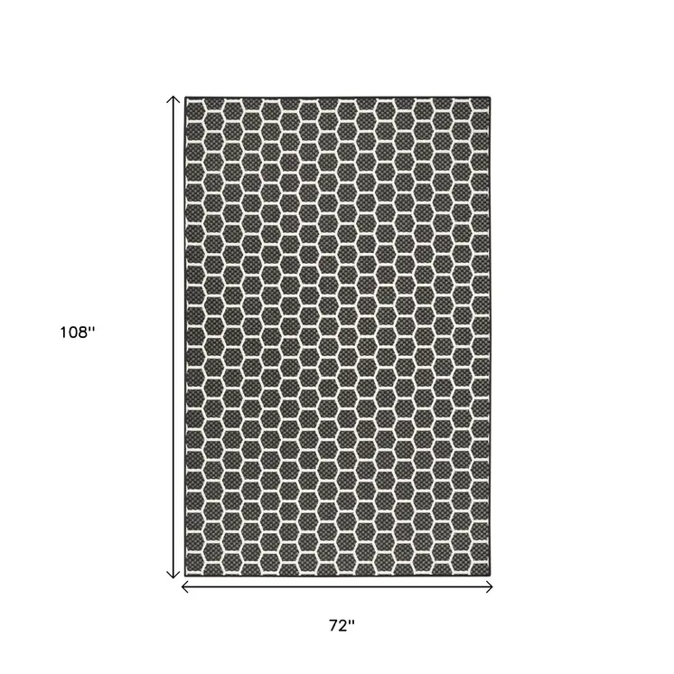 4' X 6' Black And Ivory Geometric Indoor Outdoor Area Rug