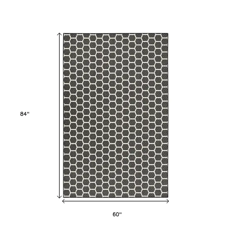 6' X 9' Black And Ivory Geometric Indoor Outdoor Area Rug