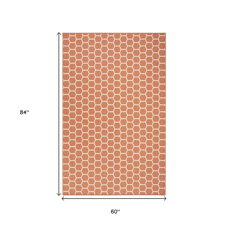 6' X 9' Coral And Ivory Geometric Indoor Outdoor Area Rug