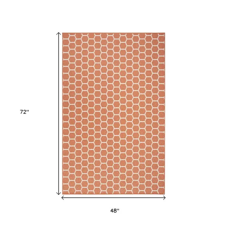 5' X 7' Coral And Ivory Geometric Indoor Outdoor Area Rug
