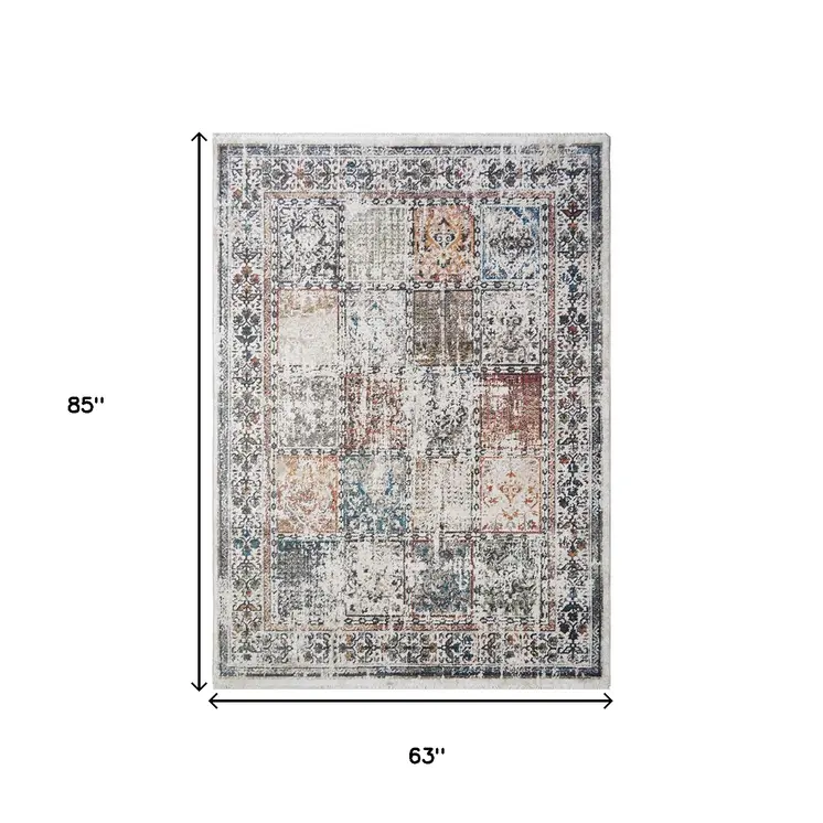 5' X 8' Ivory Oriental Distressed Area Rug With Fringe
