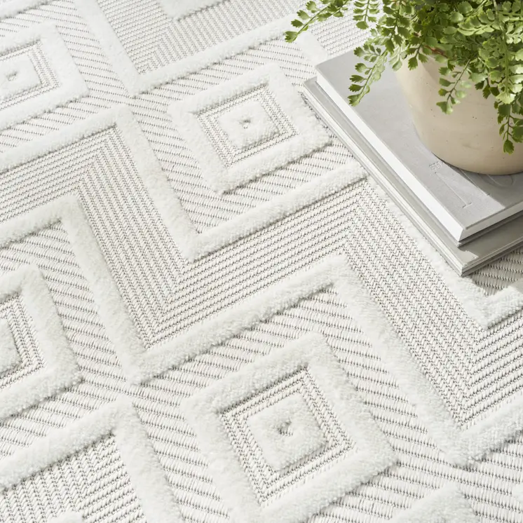 10' Ivory And White Round Geometric Indoor Outdoor Area Rug