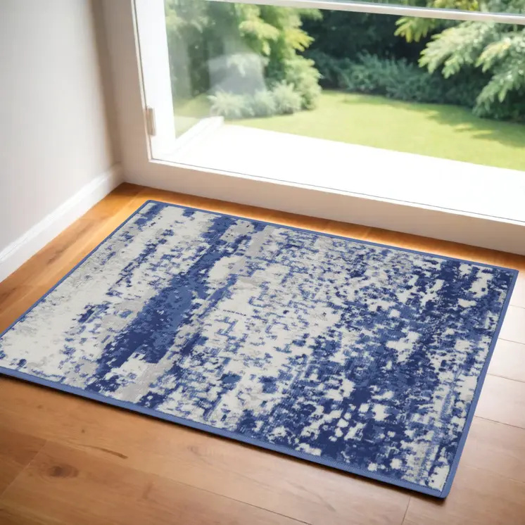 2' X 3' Ivory And Navy Blue Abstract Area Rug