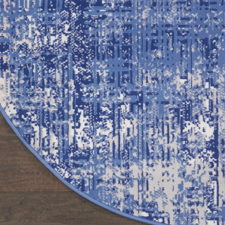 8' Ivory and Blue Abstract Distressed Round Rug