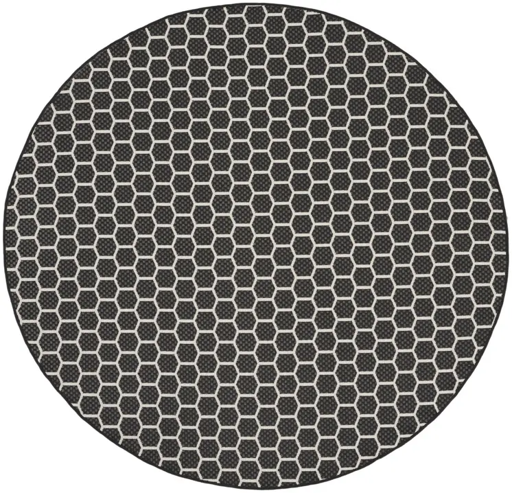 8' Black And Ivory Geometric Indoor Outdoor Area Rug