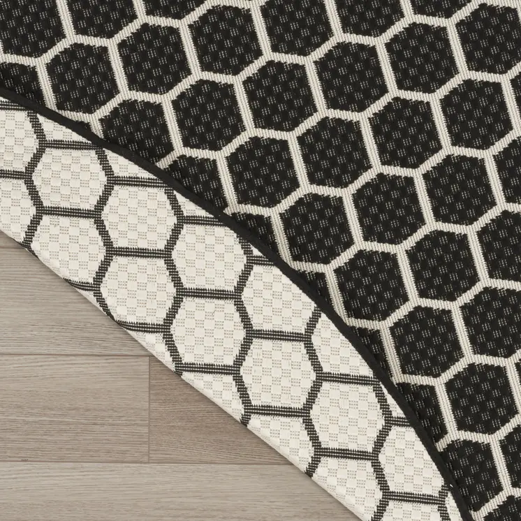 8' Black And Ivory Geometric Indoor Outdoor Area Rug