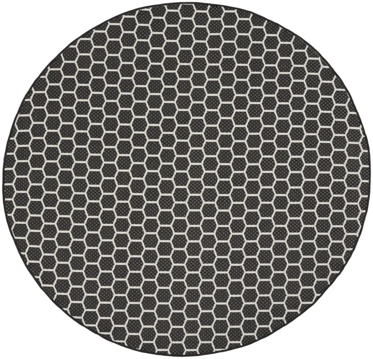 8' Black And Ivory Geometric Indoor Outdoor Area Rug
