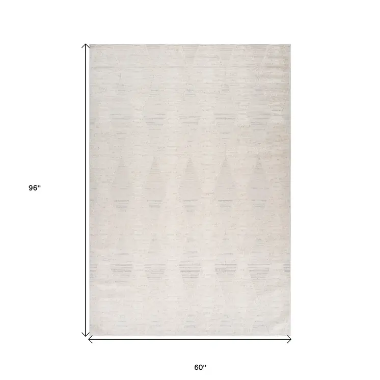 5' X 8' Cream and Beige Geometric Distressed Area Rug