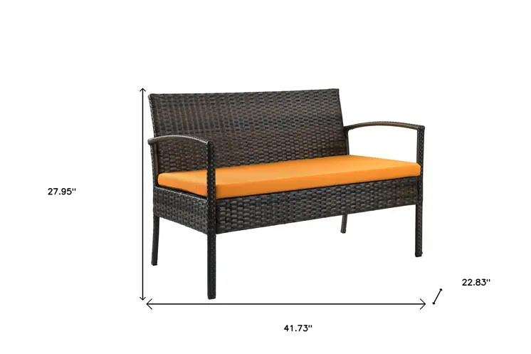 Four Piece Outdoor Dark Brown Wicker Sofa Seating Group with Orange Cushions