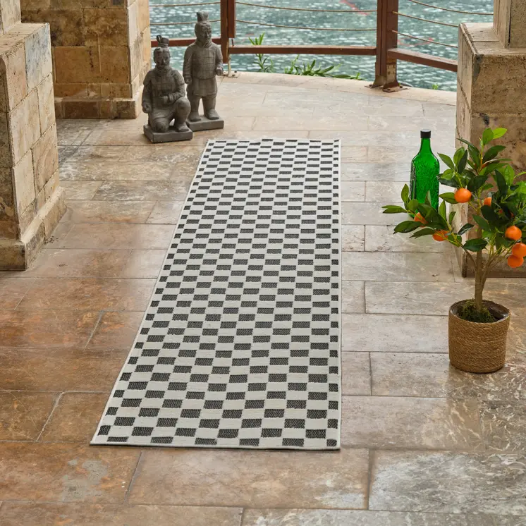 8' Black and White Geometric Distressed Indoor Outdoor Runner Rug