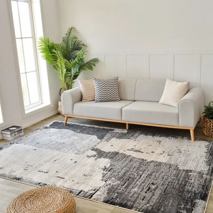 5' X 8' Beige and Black Abstract Distressed Area Rug
