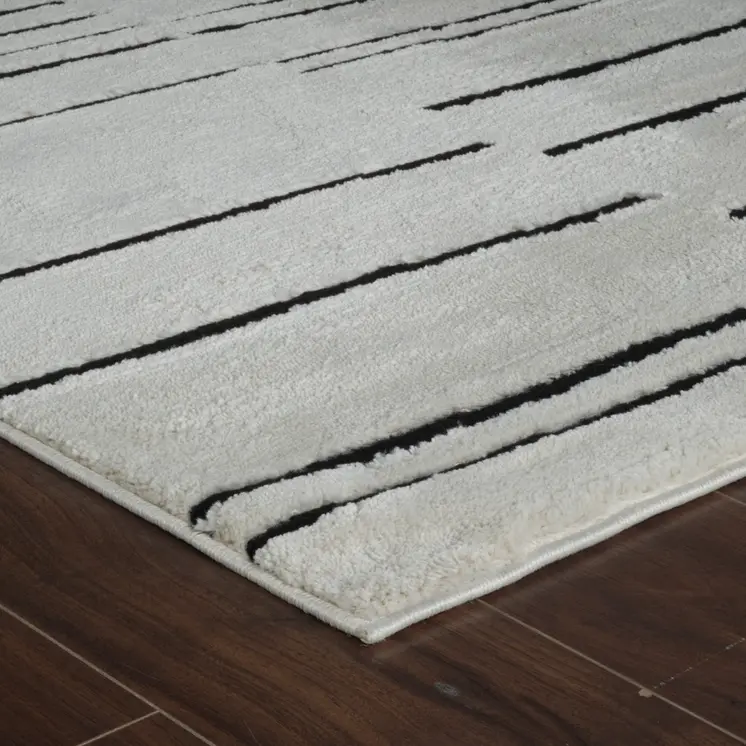 4' X 6' Cream and Black Abstract Distressed Area Rug