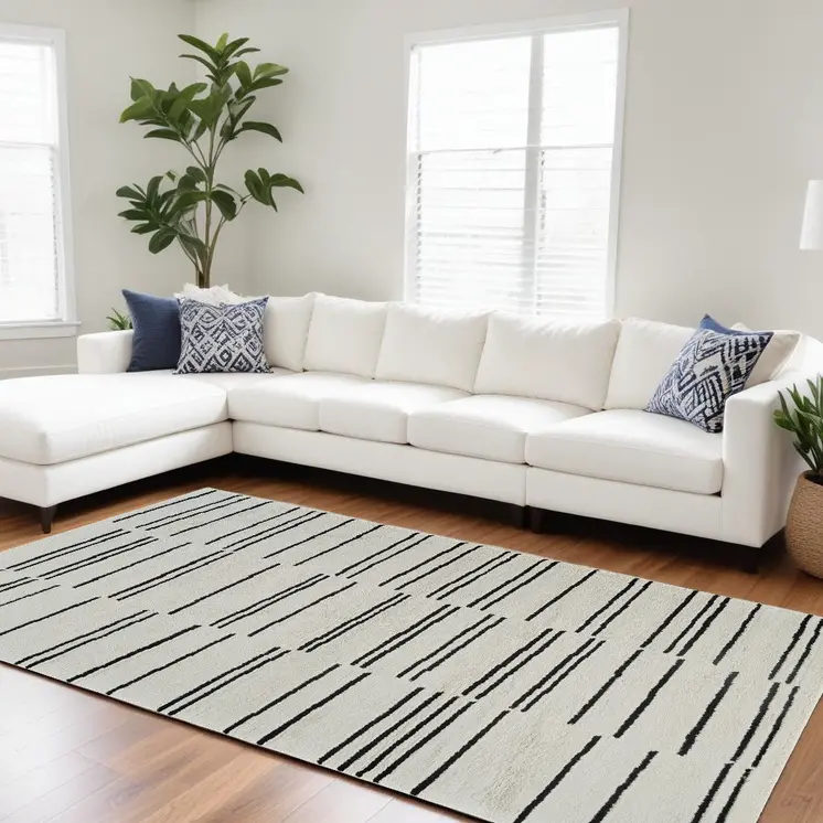8' X 11' Cream and Black Abstract Distressed Area Rug