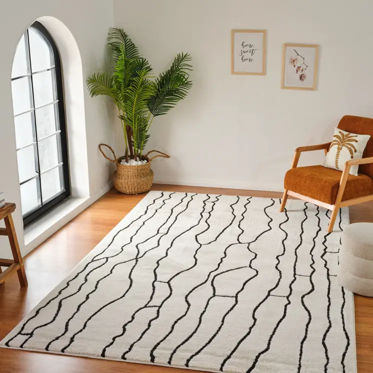 5' X 8' Cream and Black Abstract Distressed Area Rug